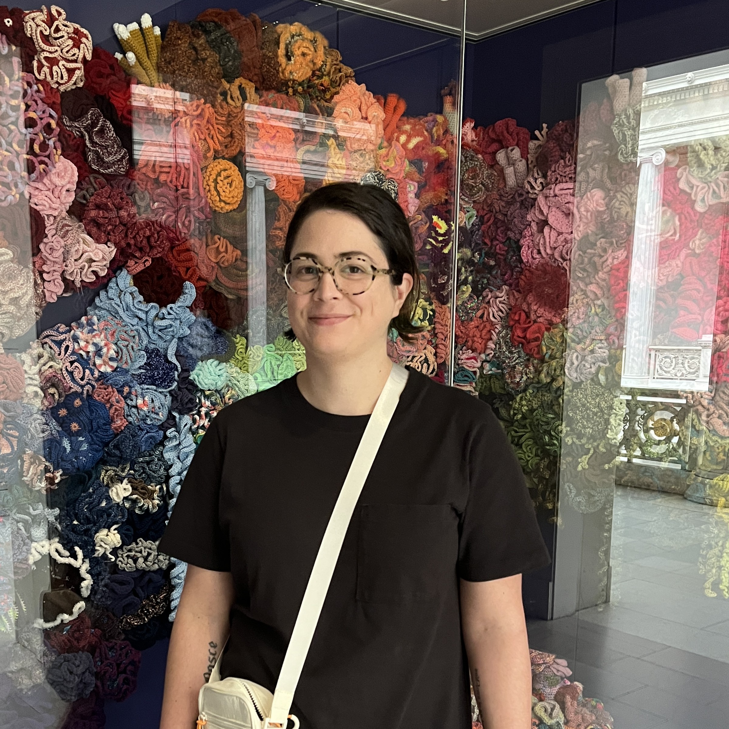 Me in front of a display of hyperbolic crocheted coral at the Carnegie Museum of Art