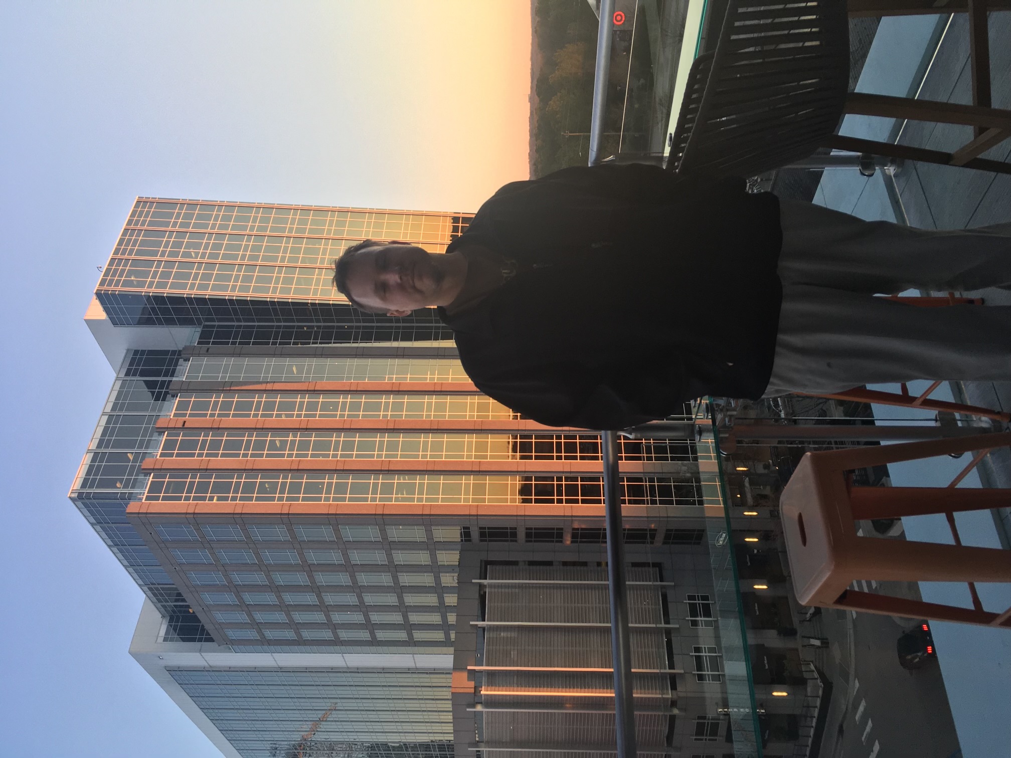 Aaron Sims standing on a terrace