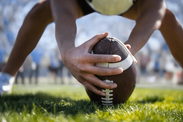 kid snapping football