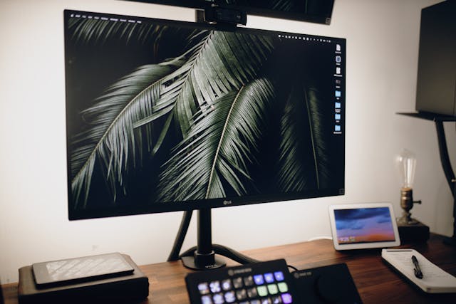A closeup of the bottom monitor of the full computer setup