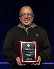 Dr. Perez-Quinones accepting award at SIGCSE2026