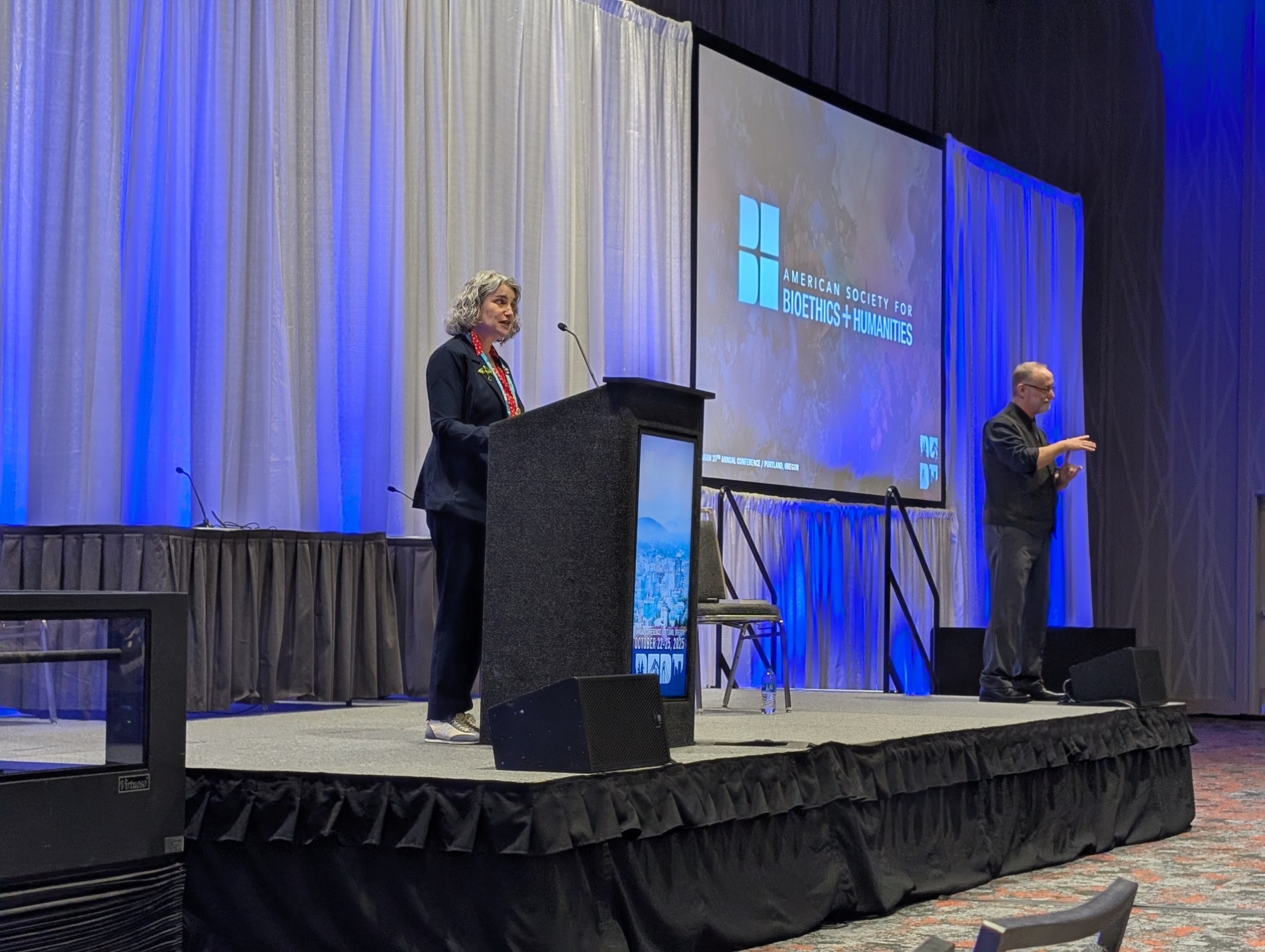 Toby L. Schonfeld speaking at a professional conference