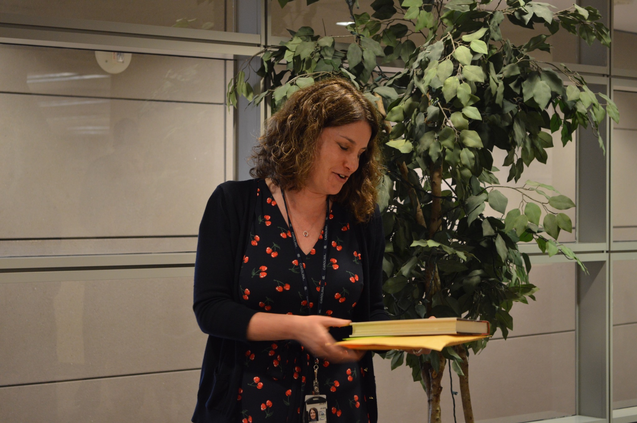 Toby Schonfeld presenting a book during an academic event